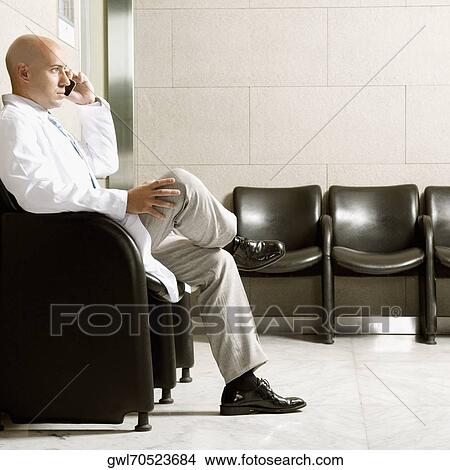 Doctor talking on a mobile phone View Large Photo Image Picture - Doctor talking on a mobile phone. Fotosearch