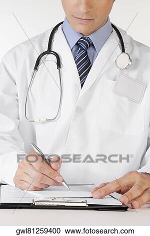 Doctor writing on a clipboard View Large Photo Image Stock Image - Doctor writing on a clipboard. Fotosearch