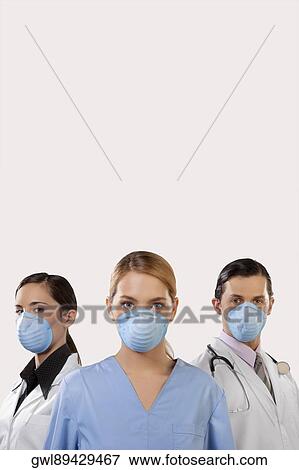 Doctors wearing flu masks View Large Photo Image Stock Photo - Doctors wearing flu masks. Fotosearch
