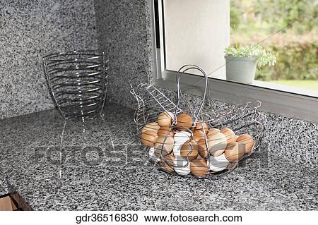 Eggs in a wire basket on a kitchen counter View Large Photo Image Stock Image - Eggs in a wire basket on a kitchen counter. Fotosearch