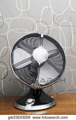 Electric fan on a sideboard View Large Photo Image Stock Photo - Electric fan on a sideboard. Fotosearch