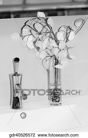 Faucet with a vase in the bathroom View Large Photo Image Stock Image - Faucet with a vase in the bathroom. Fotosearch