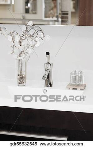 Faucet with toiletries in the bathroom View Large Photo Image Stock Photography - Faucet with toiletries in the bathroom. Fotosearch
