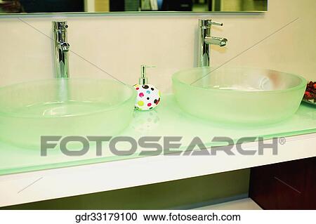 Faucets with a soap dispenser in the bathroom View Large Photo Image Stock Image - Faucets with a soap dispenser in the bathroom. Fotosearch