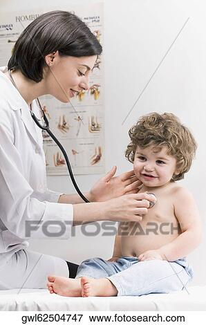 Female doctor examining a baby boy with a stethoscope View Large Photo Image Stock Photo - Female doctor examining a baby boy with a stethoscope. Fotosearch