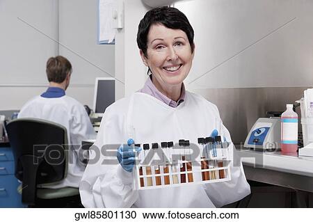 Female doctor holding medical samples in a laboratory View Large Photo Image Stock Image - Female doctor holding medical samples in a laboratory. Fotosearch