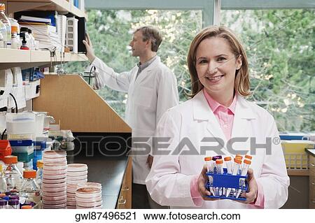 Female doctor holding medical samples in a laboratory View Large Photo Image Stock Image - Female doctor holding medical samples in a laboratory. Fotosearch