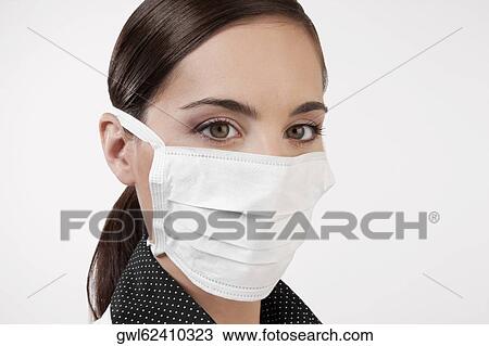 Female doctor wearing a flu mask View Large Photo Image Stock Image - Female doctor wearing a flu mask. Fotosearch