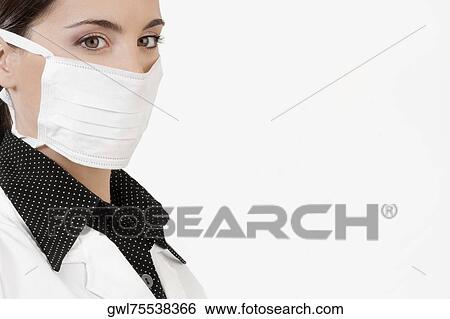 Female doctor wearing a flu mask View Large Photo Image Stock Photograph - Female doctor wearing a flu mask. Fotosearch