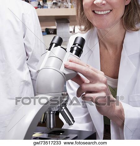 Female doctor working on a microscope in a laboratory View Large Photo Image Stock Image - Female doctor working on a microscope in a laboratory. Fotosearch