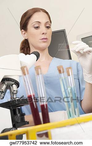 Female lab technician analyzing a sample in a laboratory View Large Photo Image Stock Image - Female lab technician analyzing a sample in a laboratory. Fotosearch