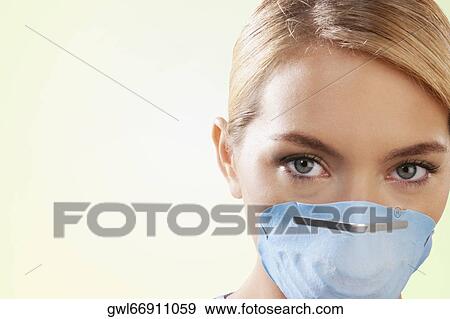 Female nurse wearing a flu mask View Large Photo Image Stock Photo - Female nurse wearing a flu mask. Fotosearch