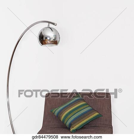 Floor lamp along with a bed View Large Photo Image Stock Photo - Floor lamp along with a bed. Fotosearch