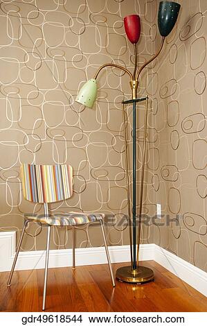 Picture - Floor lamp with a chair. Fotosearch