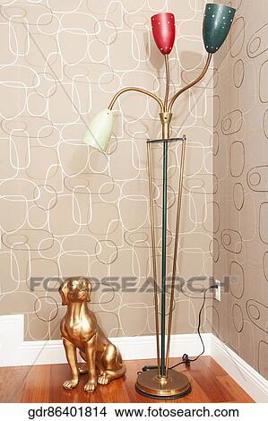 Picture - Floor lamp with a statue of dog. Fotosearch