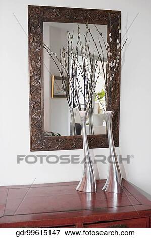 Stock Photo - Flower vases on a sideboard. Fotosearch