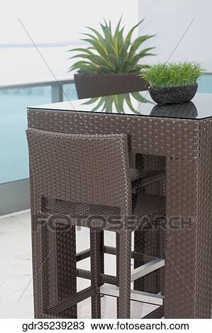 Furniture in the balcony of a house View Large Photo Image Stock Image - Furniture in the balcony of a house. Fotosearch