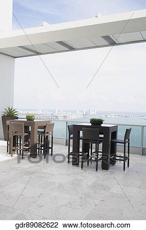Furniture in the balcony of a house View Large Photo Image Stock Image - Furniture in the balcony of a house. Fotosearch