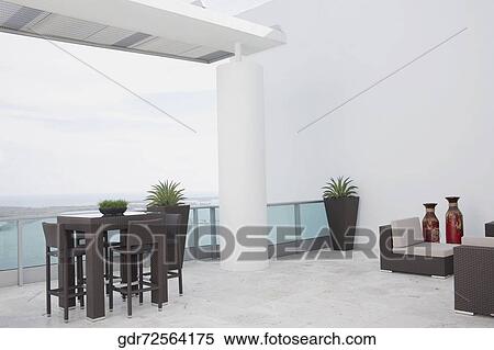 Furniture in the balcony of a house View Large Photo Image Stock Photography - Furniture in the balcony of a house. Fotosearch