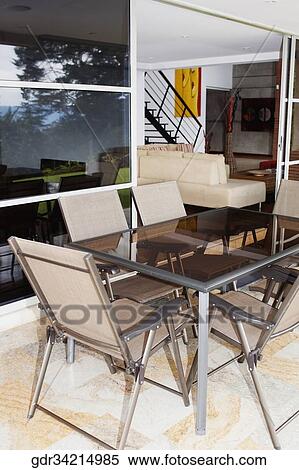 Stock Photography - Furniture in the porch of a house. Fotosearch