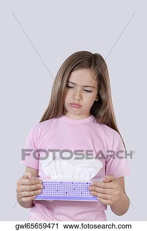 Girl holding a flu mask box View Large Photo Image Stock Image - Girl holding a flu mask box. Fotosearch