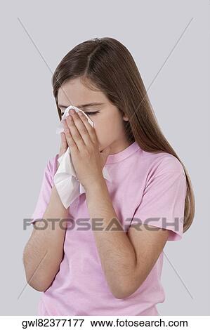 Girl suffering from cold View Large Photo Image Stock Photo - Girl suffering from cold. Fotosearch