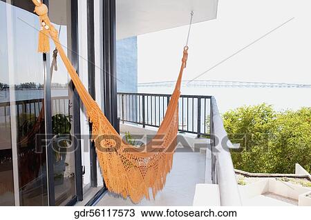 Hammock hanging at the balcony View Large Photo Image Stock Image - Hammock hanging at the balcony. Fotosearch