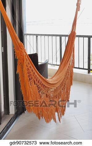 Hammock hanging at the balcony View Large Photo Image Stock Image - Hammock hanging at the balcony. Fotosearch