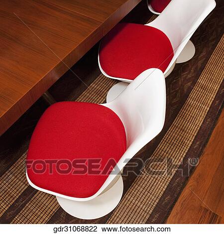 High angle view of a dining table with chairs View Large Photo Image Stock Image - High angle view of a dining table with chairs. Fotosearch