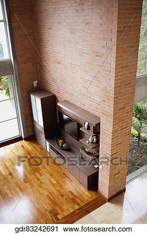 Stock Image - High angle view of a shelf in a living room. Fotosearch