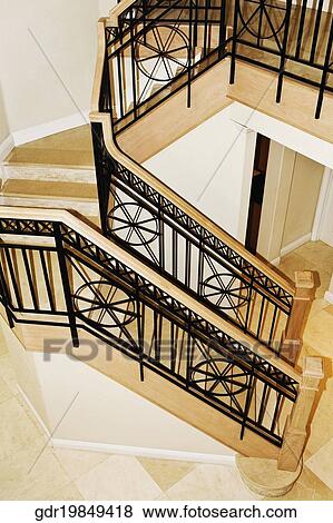 High angle view of a staircase in a house View Large Photo Image Stock Photo - High angle view of a staircase in a house. Fotosearch