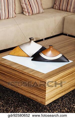 Stock Image - Incense stick holders on a table. Fotosearch