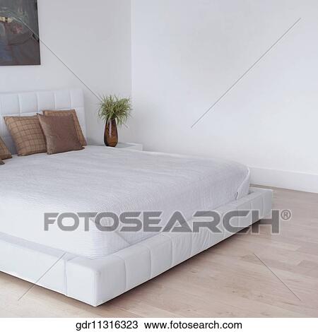 Stock Image - Interiors of a bedroom. Fotosearch