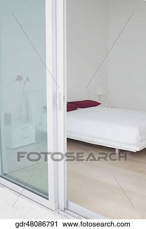 Stock Image - Interiors of a bedroom. Fotosearch