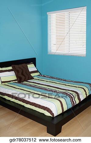 Stock Image - Interiors of a bedroom. Fotosearch