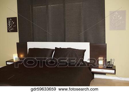 Interiors of a bedroom View Large Photo Image Stock Photo - Interiors of a bedroom. Fotosearch