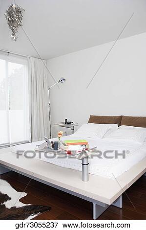 Stock Photo - Interiors of a bedroom. Fotosearch