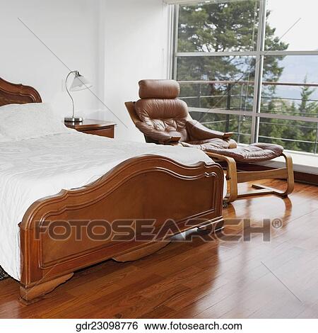Interiors of a bedroom View Large Photo Image Stock Photograph - Interiors of a bedroom. Fotosearch