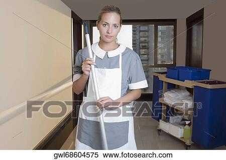 Janitor cleaning the corridor of a hospital View Large Photo Image Stock Photography - Janitor cleaning the corridor of a hospital. Fotosearch