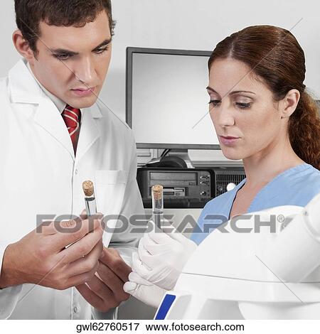 Lab technicians analyzing sample in test tubes View Large Photo Image Stock Photo - Lab technicians analyzing sample in test tubes. Fotosearch