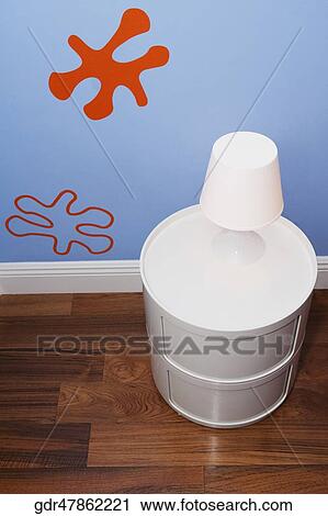 Stock Image - Lamp on a side table. Fotosearch
