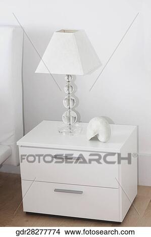 Picture - Lampshade on a night table. Fotosearch