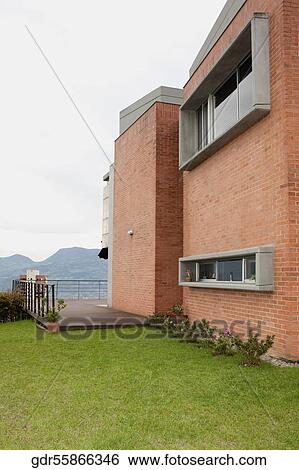 Lawn in the backyard of a house View Large Photo Image Stock Photograph - Lawn in the backyard of a house. Fotosearch
