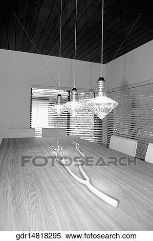 Lights hanging over a dining table View Large Photo Image Stock Photography - Lights hanging over a dining table. Fotosearch