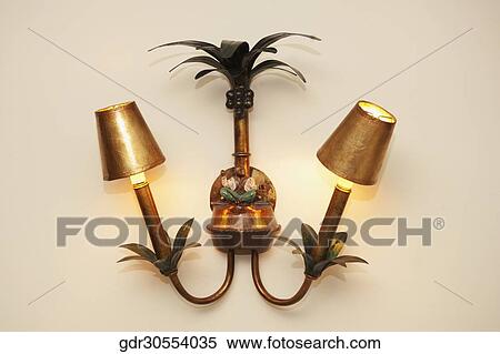 Lit lamps mounted on the wall View Large Photo Image Stock Photography - Lit lamps mounted on the wall. Fotosearch