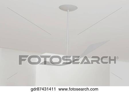 Low angle view of a ceiling fan View Large Photo Image Stock Image - Low angle view of a ceiling fan. Fotosearch