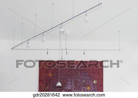 Low angle view of hanging lights View Large Photo Image Stock Image - Low angle view of hanging lights. Fotosearch