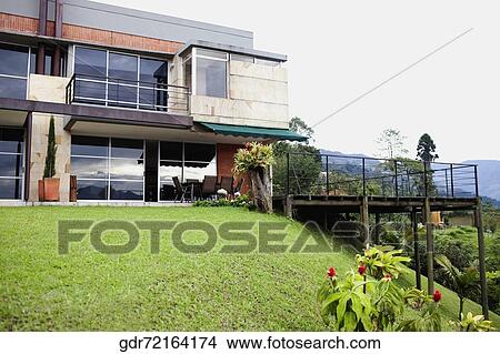 Low angle view of house on a hill View Large Photo Image Picture - Low angle view of house on a hill. Fotosearch
