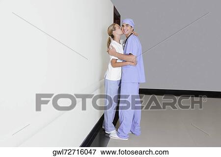Male and a female nurse romancing in a hospital corridor View Large Photo Image Stock Photo - Male and a female nurse romancing in a hospital corridor. Fotosearch