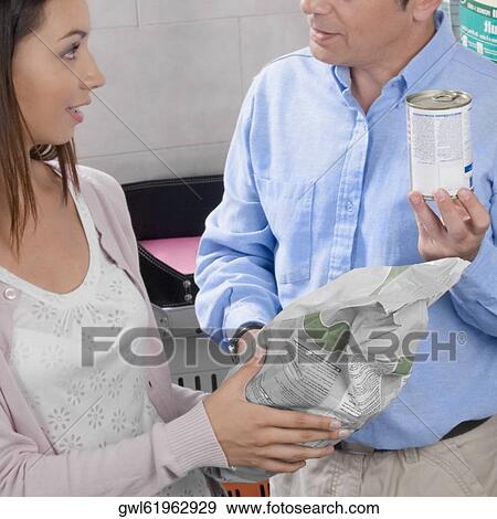 Man and his daughter shopping dog food in a supermarket View Large Photo Image Stock Photo - Man and his daughter shopping dog food in a supermarket. Fotosearch